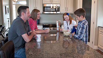 family in Duvanco kitchen